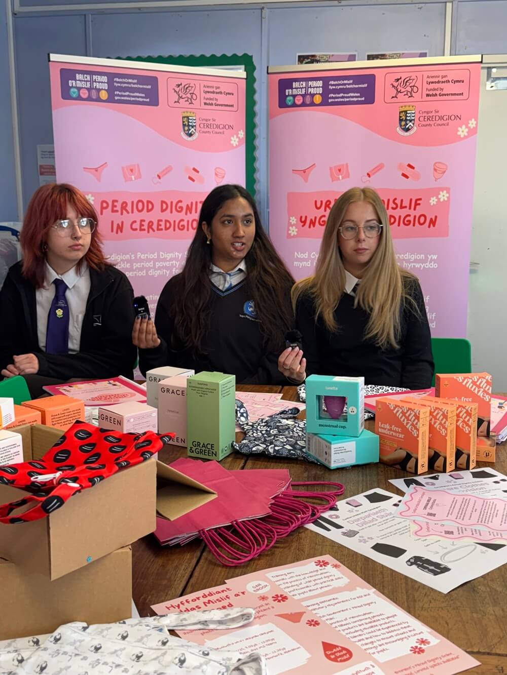 3 girls with period dignity products
